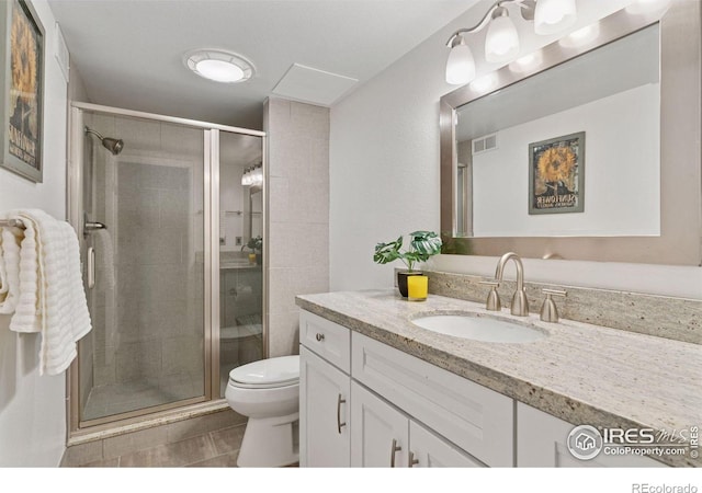 4094 Bimini Ct, Boulder, CO 80301 - bathroom featuring vanity, toilet, a shower stall, and tile patterned floors