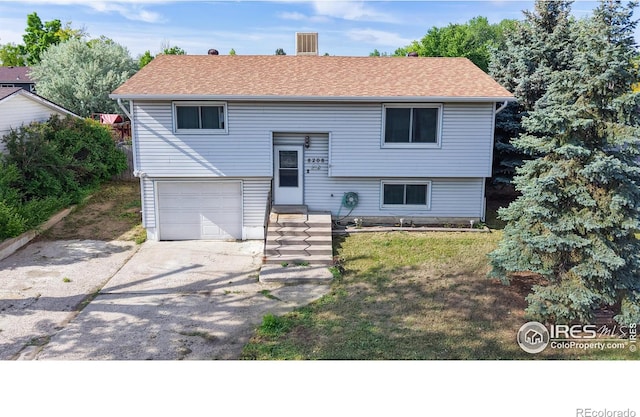 8208 Peakview Dr, Fort Collins, CO 80528 - bi-level home with a garage, driveway, and a front yard
