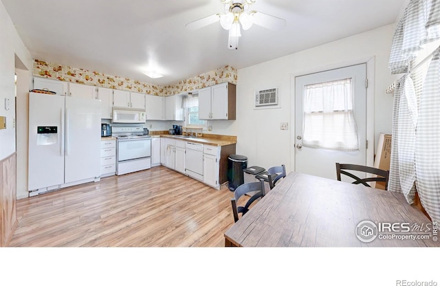 8208 Peakview Dr, Fort Collins, CO 80528 - kitchen with white appliances, a sink, light wood-style flooring, ceiling fan, and light countertops