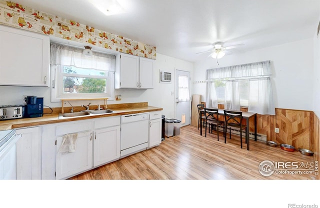 8208 Peakview Dr, Fort Collins, CO 80528 - kitchen featuring white dishwasher, a sink, ceiling fan, light wood-style floors, and light countertops