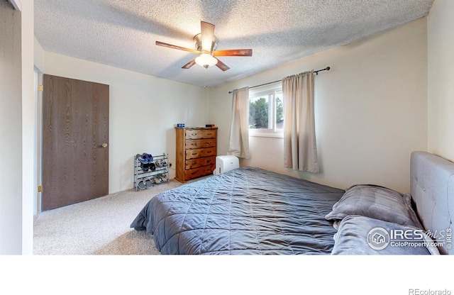 8208 Peakview Dr, Fort Collins, CO 80528 - carpeted bedroom with a textured ceiling and a ceiling fan