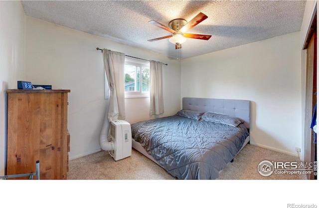 8208 Peakview Dr, Fort Collins, CO 80528 - bedroom with carpet, a textured ceiling, baseboards, and ceiling fan