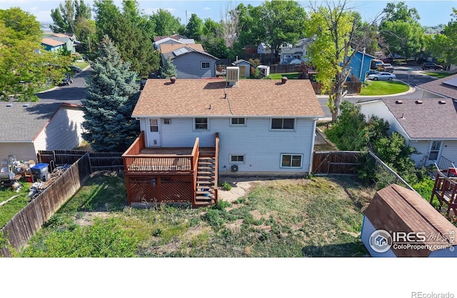 8208 Peakview Dr, Fort Collins, CO 80528 - rear view of house with a deck, stairs, a residential view, and roof with shingles