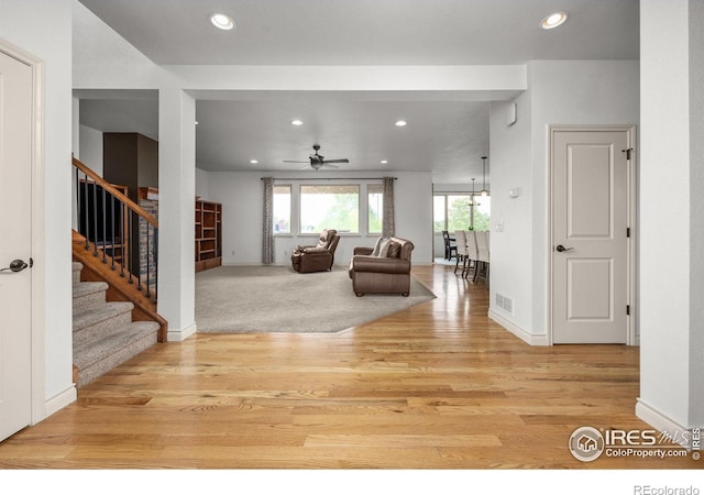 873 Signal Ct, Timnath, CO 80547 - living room featuring stairway, light wood-style flooring, recessed lighting, ceiling fan, and baseboards