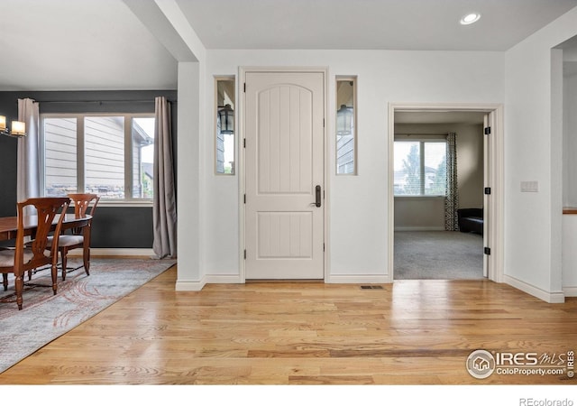873 Signal Ct, Timnath, CO 80547 - entryway featuring baseboards, light wood finished floors, and recessed lighting