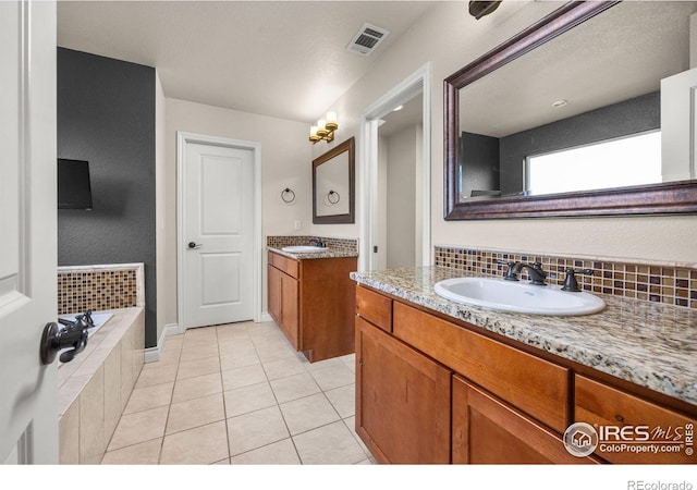 873 Signal Ct, Timnath, CO 80547 - full bathroom featuring tile patterned floors, a garden tub, and two vanities
