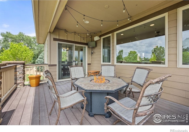 873 Signal Ct, Timnath, CO 80547 - wooden deck featuring outdoor dining space