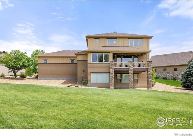 873 Signal Ct, Timnath, CO 80547 - back of property with board and batten siding and a lawn