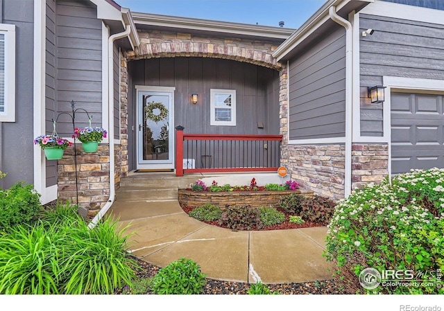 405 Timber Ridge Parkway, Severance, CO 80550 - property entrance with stone siding and a garage