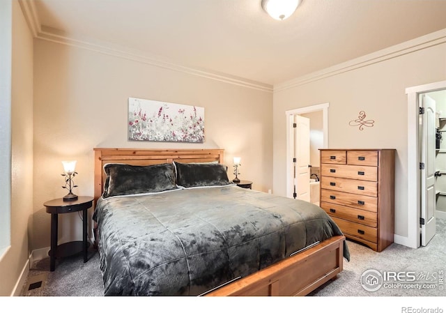 405 Timber Ridge Parkway, Severance, CO 80550 - carpeted bedroom with crown molding, baseboards, and connected bathroom