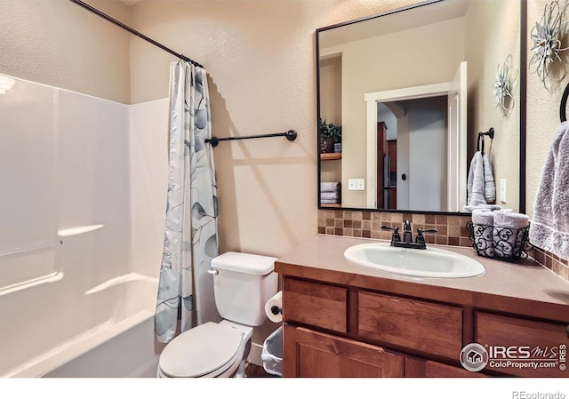 405 Timber Ridge Parkway, Severance, CO 80550 - full bathroom featuring backsplash, vanity, toilet, shower / bath combo with shower curtain, and a textured wall