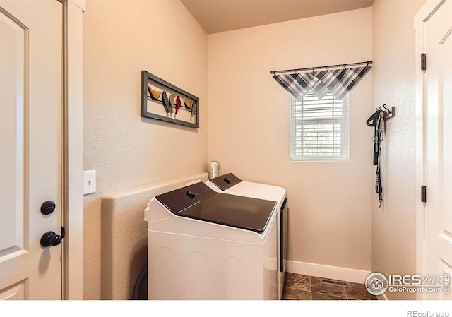 405 Timber Ridge Parkway, Severance, CO 80550 - washroom featuring washer and clothes dryer and baseboards
