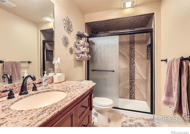 405 Timber Ridge Parkway, Severance, CO 80550 - full bath featuring a textured wall, toilet, a stall shower, and vanity