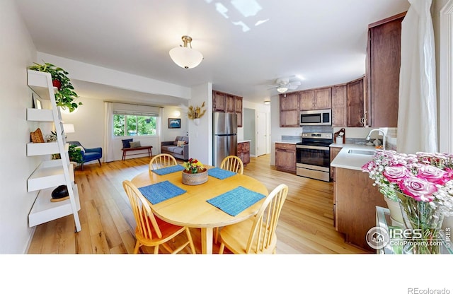 2415 Sunray Ct, Fort Collins, CO 80525 - dining room with light wood-type flooring and a ceiling fan