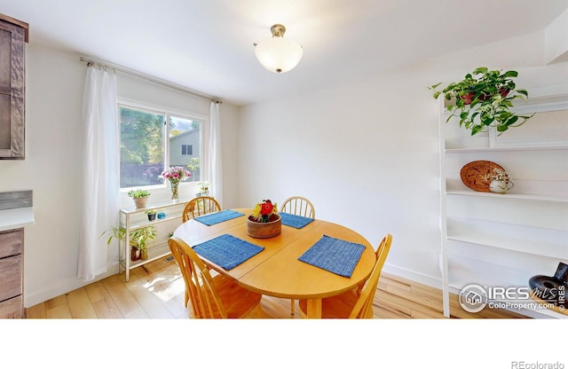 2415 Sunray Ct, Fort Collins, CO 80525 - dining space featuring light wood finished floors and baseboards
