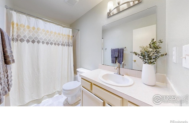 2415 Sunray Ct, Fort Collins, CO 80525 - full bath with vanity, toilet, and shower / bathtub combination with curtain