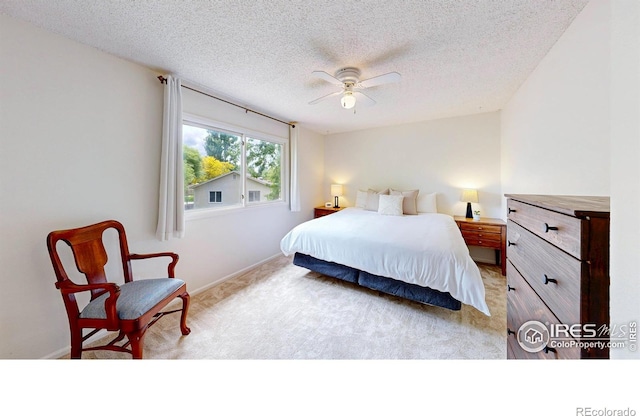 2415 Sunray Ct, Fort Collins, CO 80525 - bedroom featuring light colored carpet, a textured ceiling, baseboards, and a ceiling fan