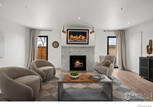 2434 Mapleton Ave, Boulder, CO 80304 - living area with a premium fireplace, wood finished floors, recessed lighting, and baseboards