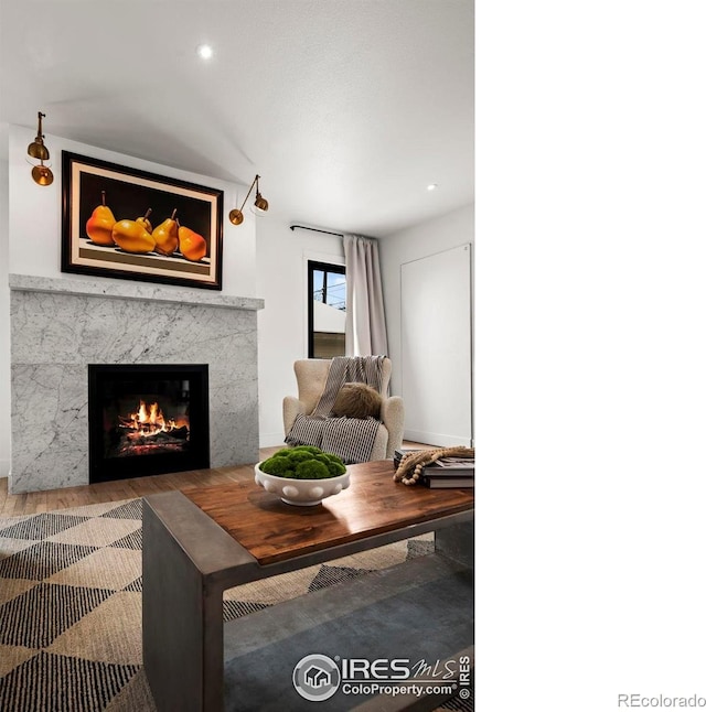 2434 Mapleton Ave, Boulder, CO 80304 - living area with a high end fireplace, wood finished floors, and recessed lighting