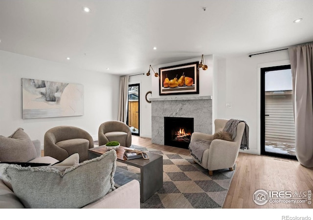 2434 Mapleton Ave, Boulder, CO 80304 - living area with a high end fireplace, recessed lighting, and wood finished floors