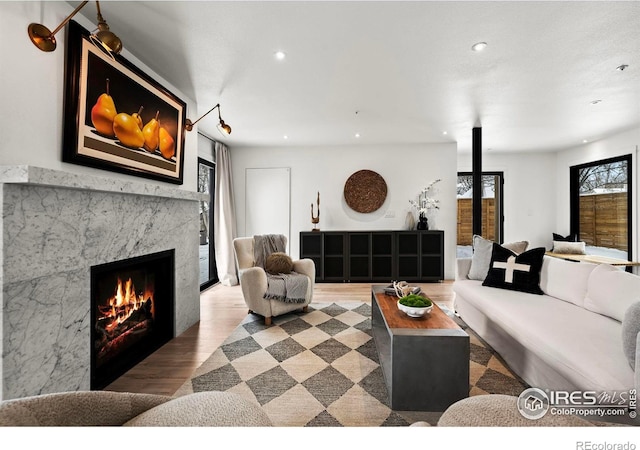 2434 Mapleton Ave, Boulder, CO 80304 - living room with wood finished floors, recessed lighting, and a high end fireplace
