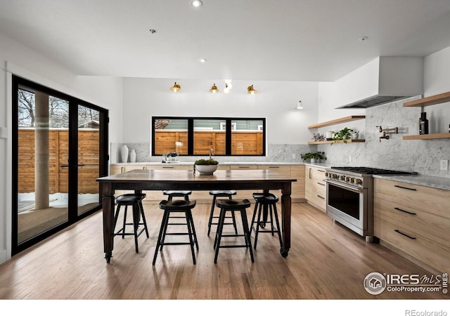 2434 Mapleton Ave, Boulder, CO 80304 - kitchen with high end stainless steel range oven, open shelves, modern cabinets, light countertops, and tasteful backsplash
