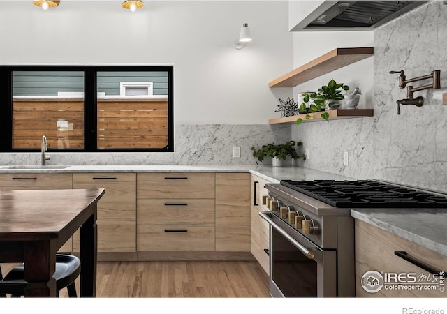 2434 Mapleton Ave, Boulder, CO 80304 - kitchen featuring stainless steel range, light brown cabinets, a sink, modern cabinets, and ventilation hood
