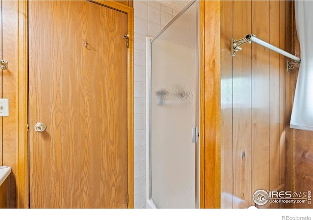 1155 Caroline Ct, Loveland, CO 80537 - full bath with a shower stall and wooden walls
