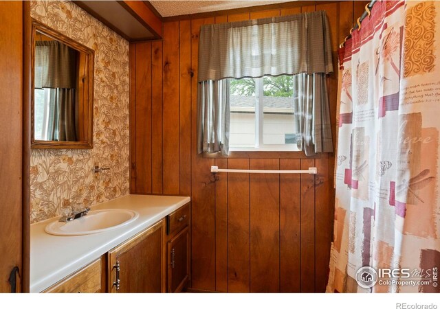1155 Caroline Ct, Loveland, CO 80537 - full bathroom featuring vanity and wallpapered walls