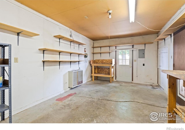 1155 Caroline Ct, Loveland, CO 80537 - misc room featuring heating unit, concrete floors, and electric panel