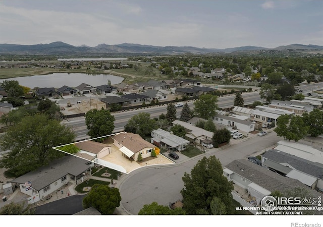 1155 Caroline Ct, Loveland, CO 80537 - aerial view of residential area featuring a water and mountain view and property boundaries highlighted