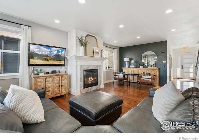 6434 Cloudburst Ave, Timnath, CO 80547 - living area featuring wood finished floors, a fireplace, and recessed lighting