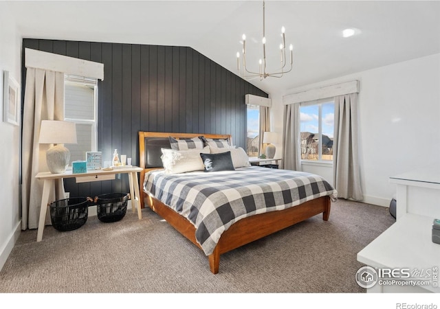 6434 Cloudburst Ave, Timnath, CO 80547 - bedroom featuring a chandelier, carpet flooring, lofted ceiling, wooden walls, and baseboards