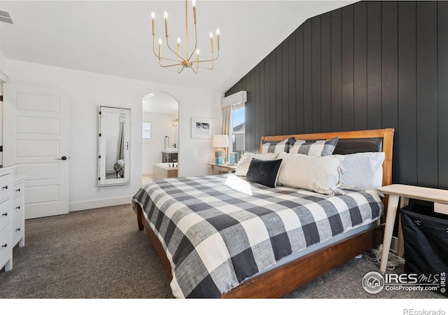 6434 Cloudburst Ave, Timnath, CO 80547 - bedroom featuring lofted ceiling, arched walkways, carpet flooring, a chandelier, and connected bathroom