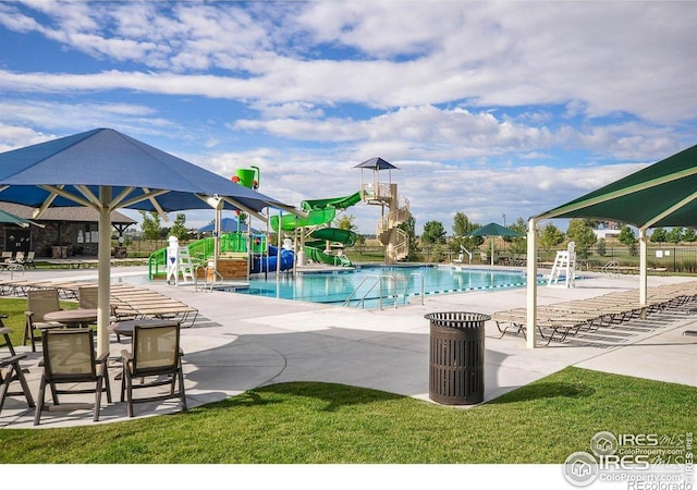 6434 Cloudburst Ave, Timnath, CO 80547 - community pool with a water slide and a patio area