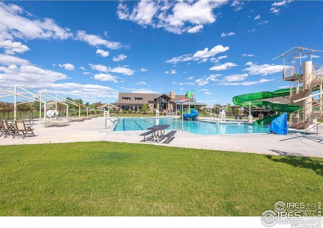 6434 Cloudburst Ave, Timnath, CO 80547 - community pool with a water slide, a yard, and a patio