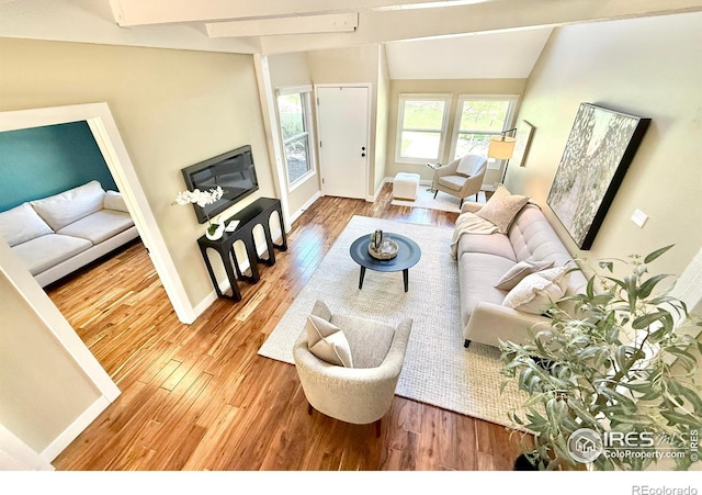 93 Benthaven Pl, Boulder, CO 80305 - living room with hardwood / wood-style flooring, vaulted ceiling, and baseboards