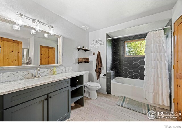 33820 County Road 47, Greeley, CO 80631 - full bathroom with vanity, toilet, shower / tub combo with curtain, and wood finished floors