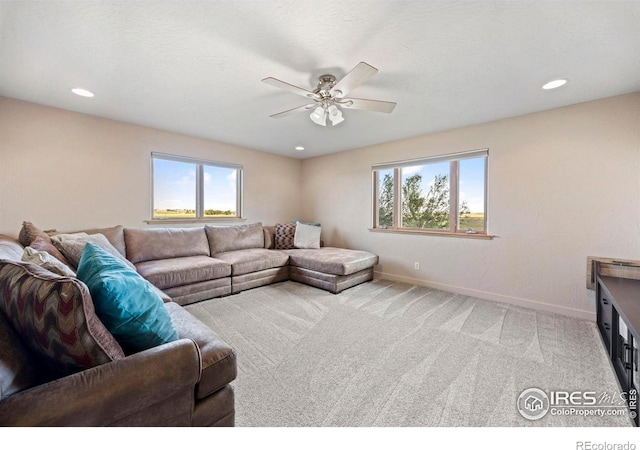 33820 County Road 47, Greeley, CO 80631 - living area with a ceiling fan, plenty of natural light, light colored carpet, baseboards, and recessed lighting