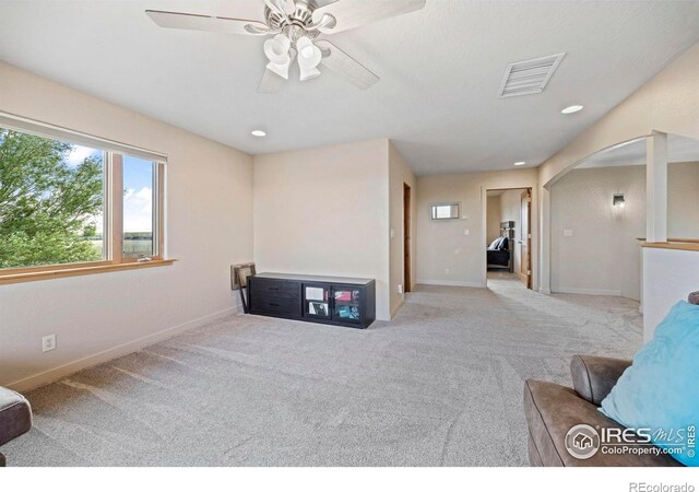 33820 County Road 47, Greeley, CO 80631 - carpeted living room featuring arched walkways, ceiling fan, baseboards, and recessed lighting