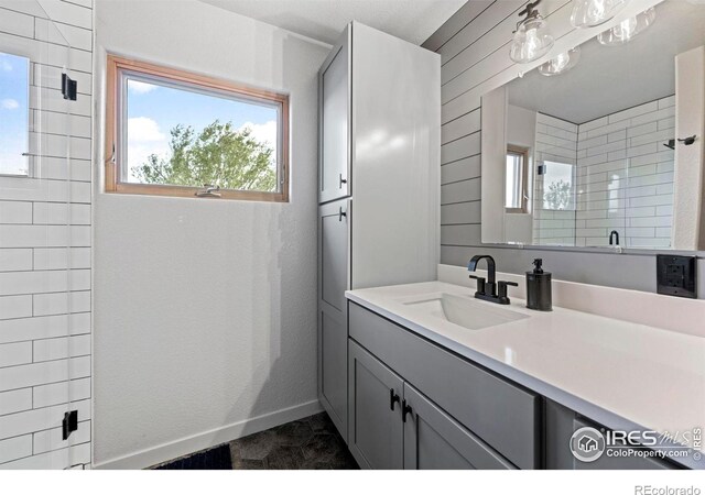 33820 County Road 47, Greeley, CO 80631 - full bathroom featuring vanity and tiled shower