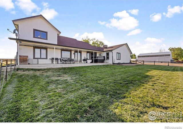 33820 County Road 47, Greeley, CO 80631 - rear view of property featuring a patio area and stucco siding
