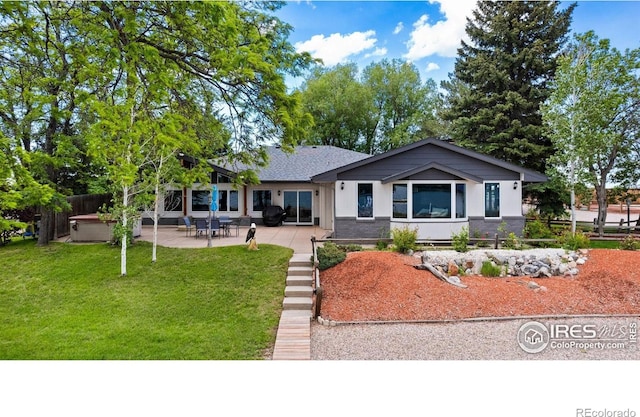 8537 S County Road 13, Fort Collins, CO 80525 - back of house featuring a yard and a patio