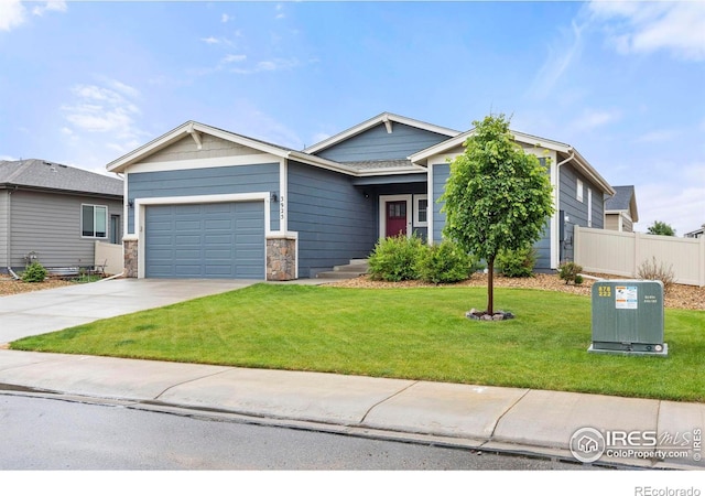 3925 Buckthorn St, Wellington, CO 80549 - view of front of house featuring an attached garage, concrete driveway, and stone siding