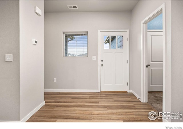 3925 Buckthorn St, Wellington, CO 80549 - foyer entrance with wood finished floors and baseboards