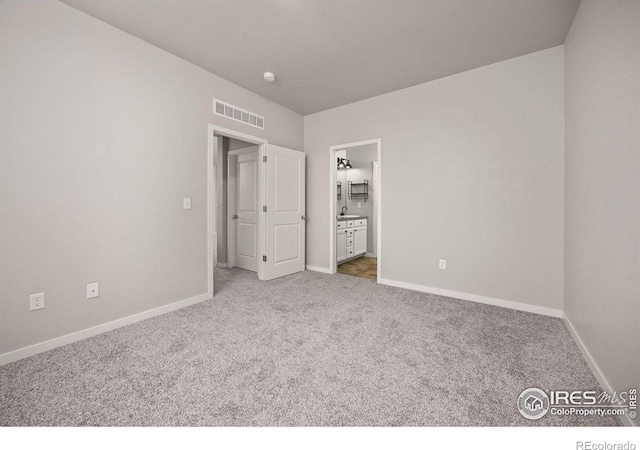 3925 Buckthorn St, Wellington, CO 80549 - unfurnished bedroom with carpet flooring, baseboards, and ensuite bath