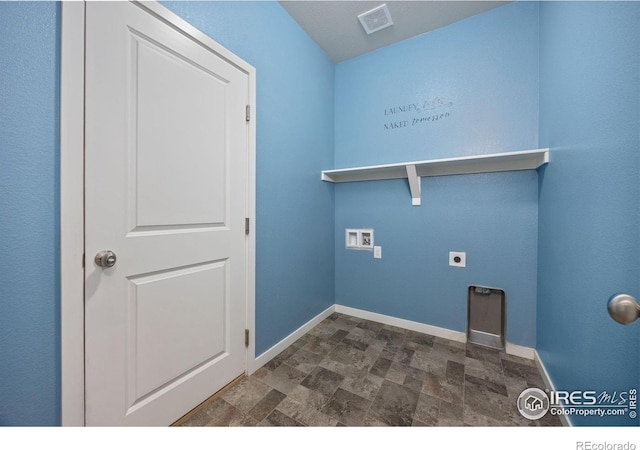3925 Buckthorn St, Wellington, CO 80549 - washroom featuring washer hookup, electric dryer hookup, stone finish flooring, and baseboards