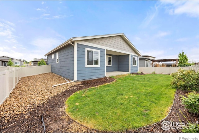 3925 Buckthorn St, Wellington, CO 80549 - rear view of house with a patio area