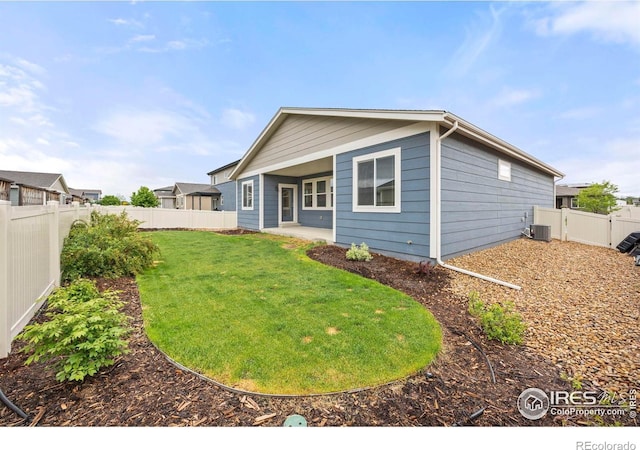 3925 Buckthorn St, Wellington, CO 80549 - back of property with a patio area and central AC unit
