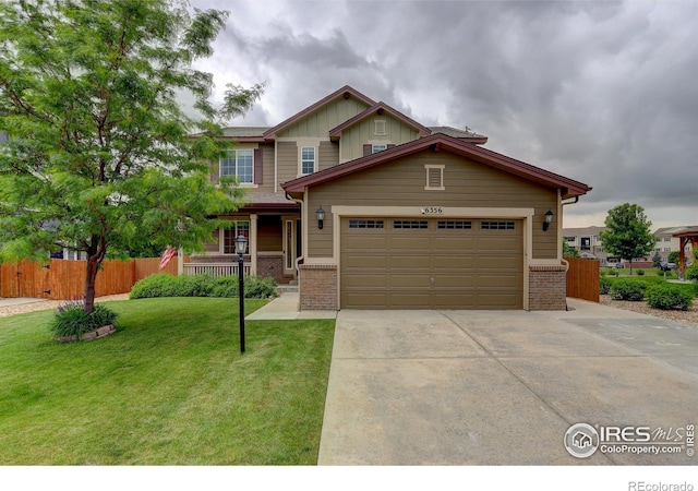 6356 Twilight Ave, Firestone, CO 80504 - craftsman inspired home with brick siding, driveway, a garage, and covered porch